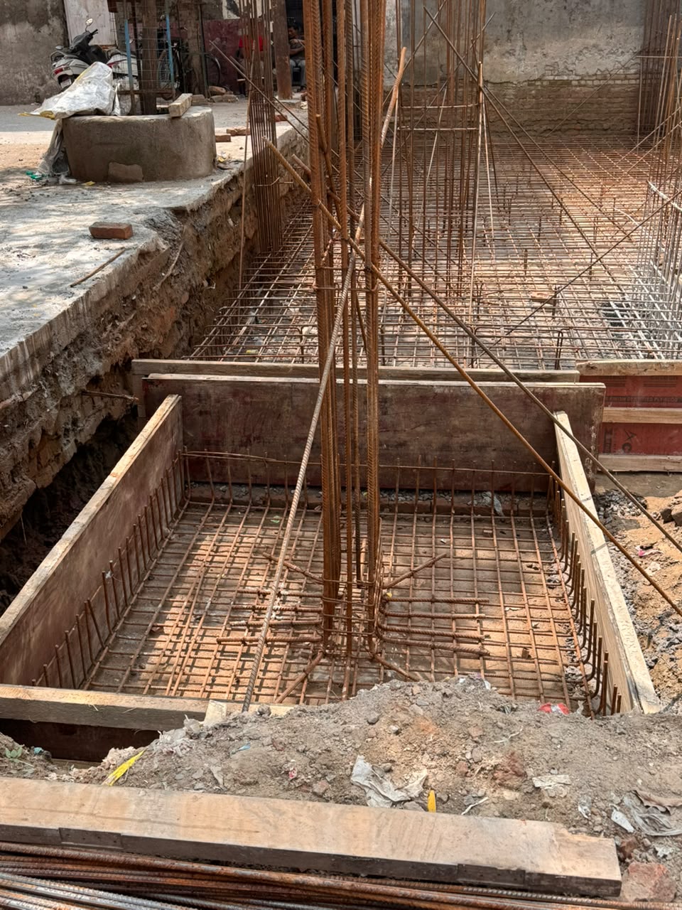 Footing formwork and rebar cage being tied at our Sector 15 Noida site
