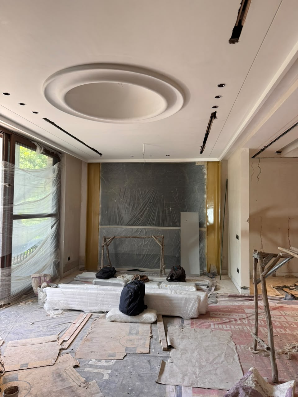 Concentric gypsum false ceiling medallion in the living hall of our Sector 41F Noida kothi